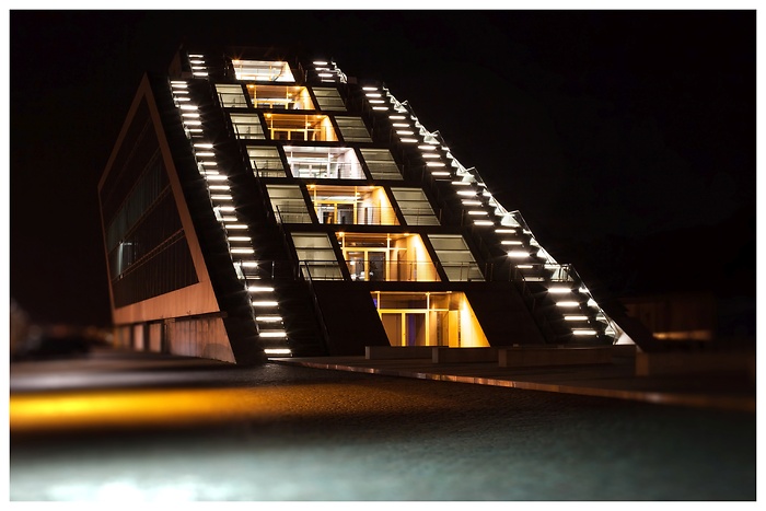 Illuminated Dockland building in Hamburg by night